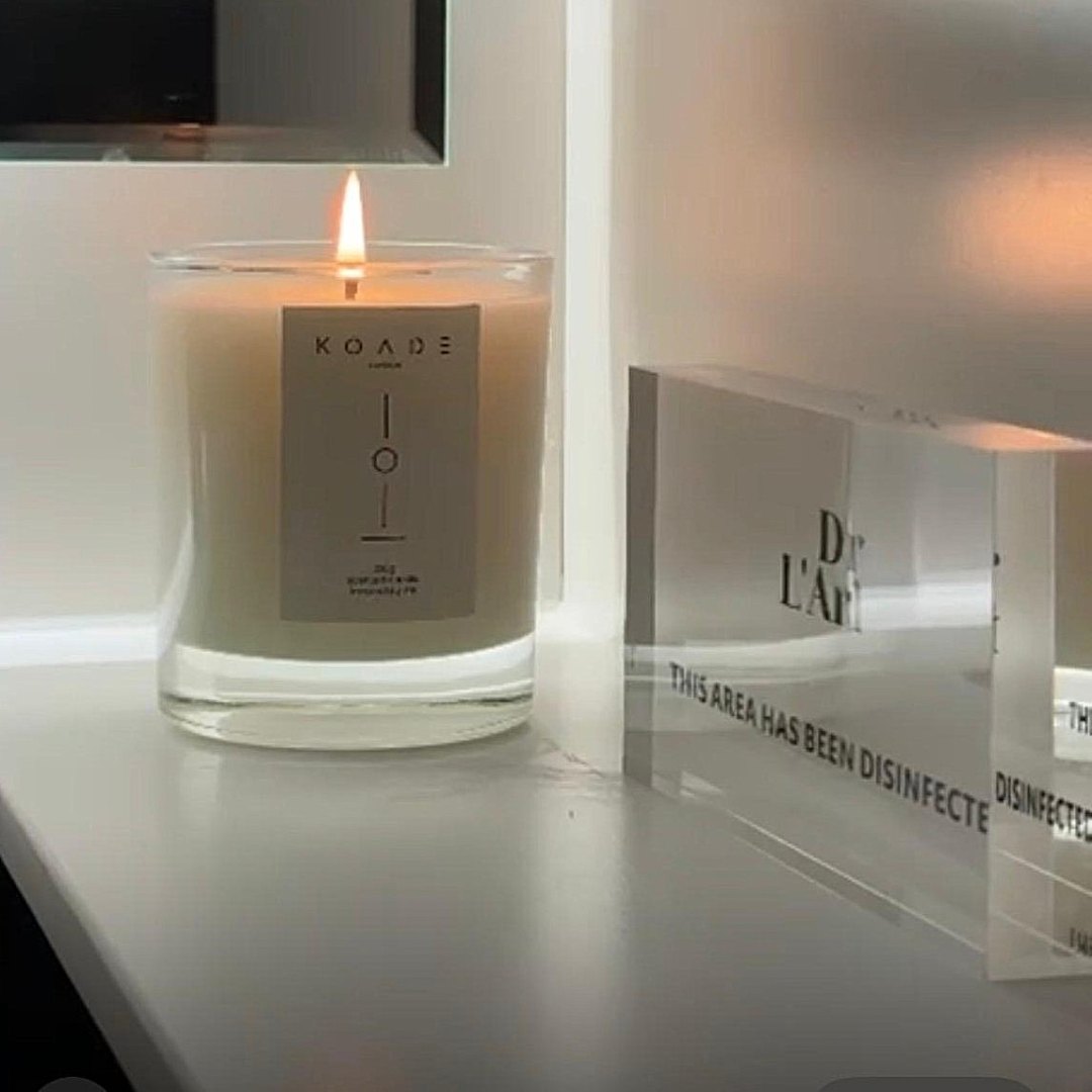 KOADE Glass candle lit in a clinic space