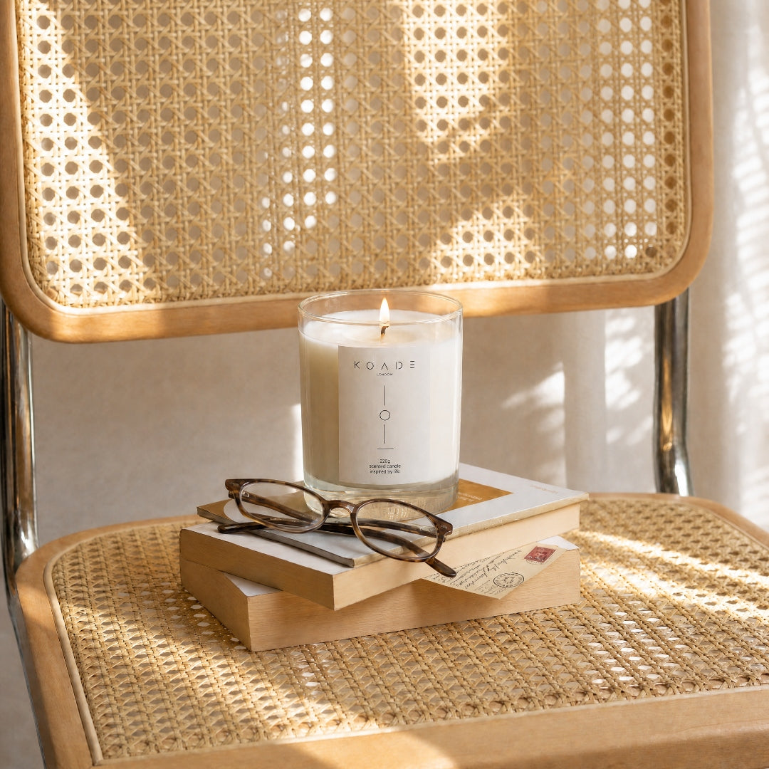 Candle on top of a book on a chair