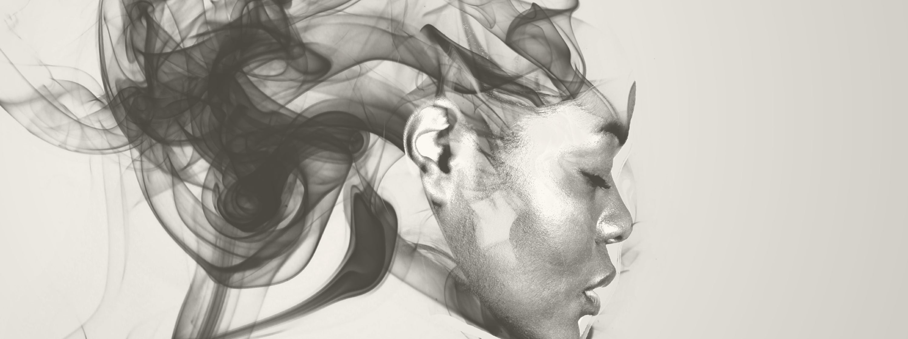 Black and white illustration of a woman's profile with abstract hair design