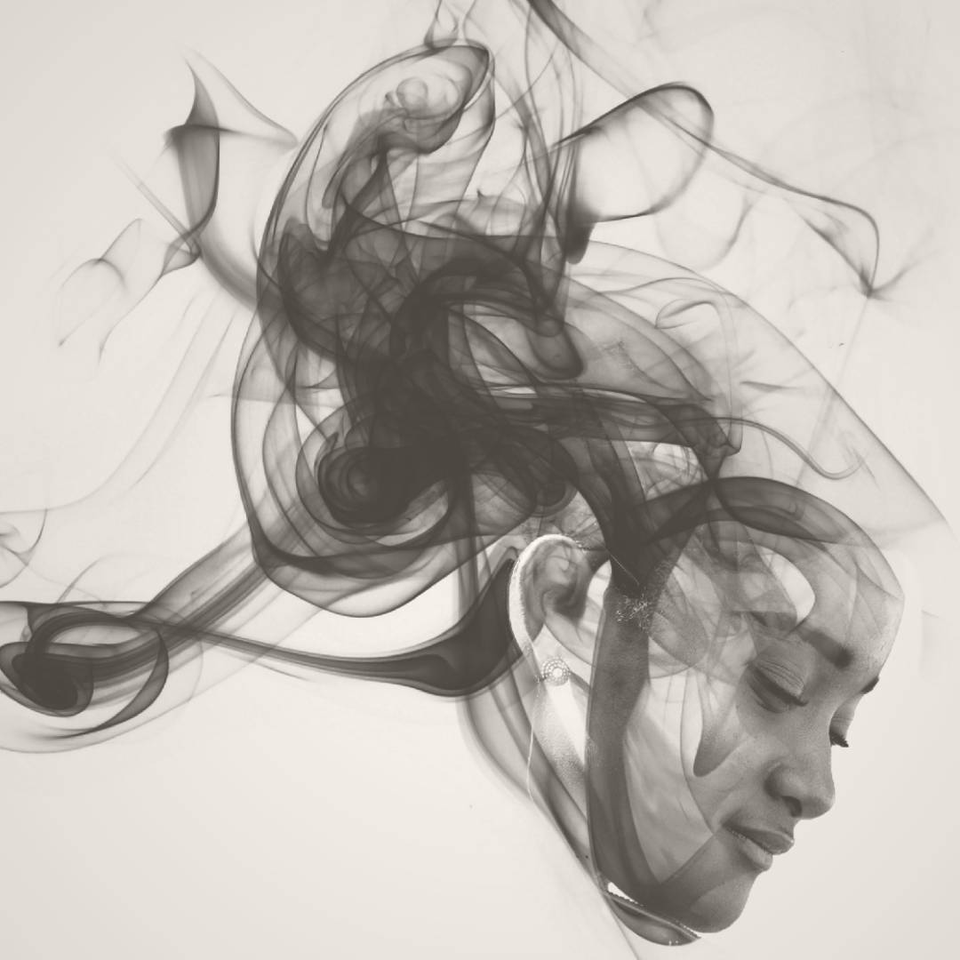 Smoke effect on profile on lady's face in grey